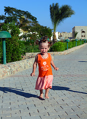 Image showing happy little girl running