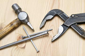 Image showing Old hammer ans screw