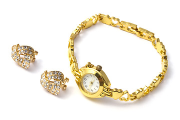 Image showing golden wrist watch and earrings