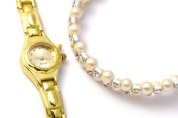 Image showing Golden wrist watch and necklace 