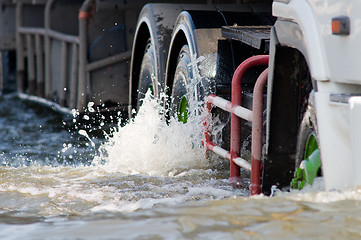 Image showing Detail of truck driving on a flooded road