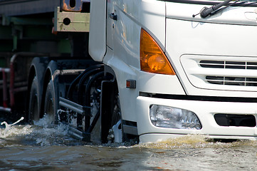 Image showing Detail of truck driving on a flooded road