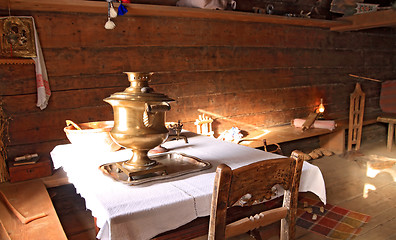 Image showing old samovar in wooden house