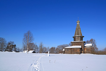 Image showing wooden chapel on snow field