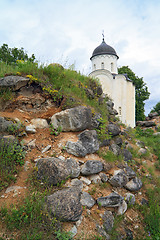 Image showing aging christian church amongst stone