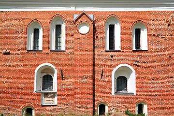 Image showing white window in red brick wall