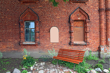 Image showing red bench in the churchyard