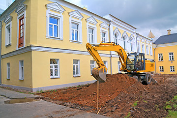 Image showing excavator near townhouse