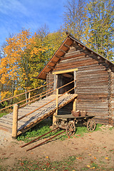 Image showing aging cart near wooden barn 