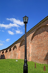 Image showing old torch near fortress wall