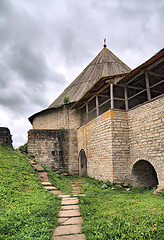 Image showing aging fortress on green hill