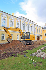 Image showing excavator near townhouse