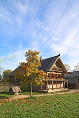 Image showing yellow tree near rural building