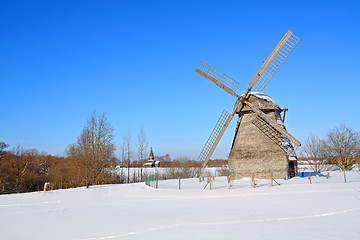 Image showing aging mill on winter field