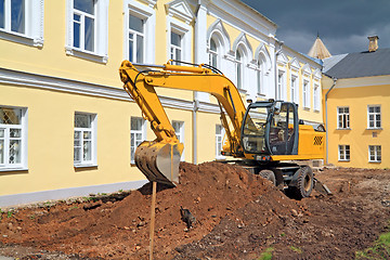 Image showing excavator near townhouse