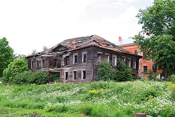 Image showing old wooden house on green field