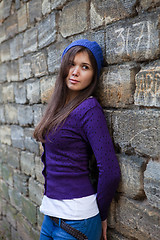 Image showing Girl in lilac against the wall