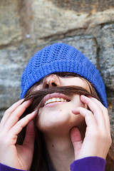 Image showing Portrait of a young girl with moustache