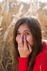 Image showing Portrait of girl covering her mouth with hand