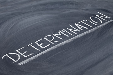 Image showing determination word on blackboard