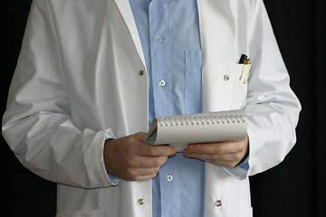 Image showing Doctor or scientist reading