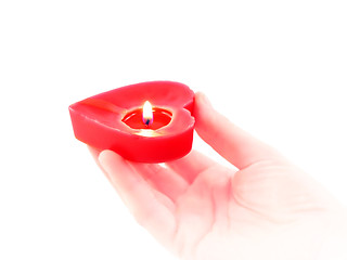 Image showing candle heart in a human hand 
