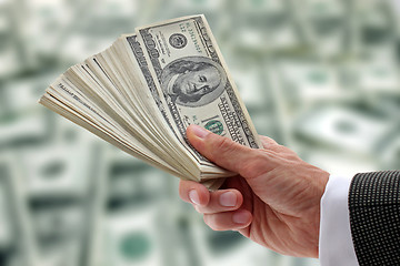 Image showing businessman holding dollars