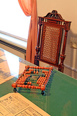 Image showing wooden abacus on green table