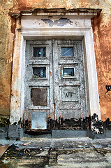 Image showing aging door in destroyed house