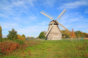 Image showing aging mill on autumn meadow