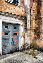 Image showing aging door in destroyed building