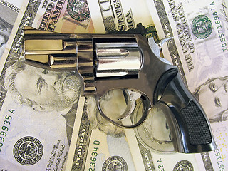 Image showing gun on dollars 