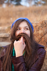 Image showing Portrait of a young girl with moustache