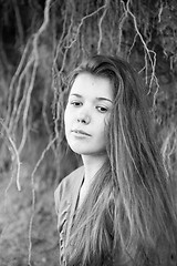 Image showing Portrait of a girl with tree root on background