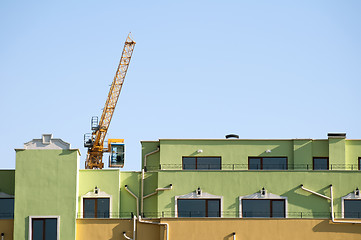 Image showing New colored building and crane
