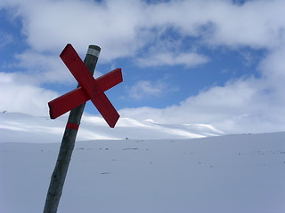 Image showing Red cross sign in snowy landscape