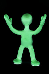 Image showing Shaded puppet of plasticine signing by hands