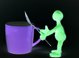 Image showing Shaded puppet of plasticine holding melhior spoon