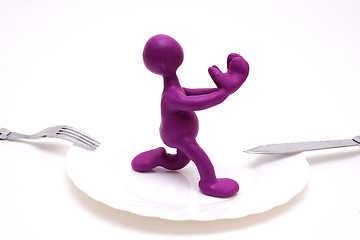 Image showing Purple puppet of plasticine begging for life
