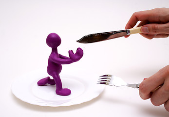 Image showing Purple puppet of plasticine begging for life