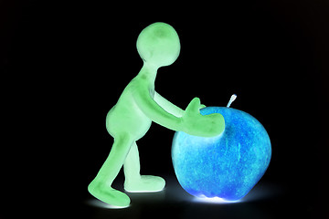 Image showing Shaded puppet of plasticine pushing done apple