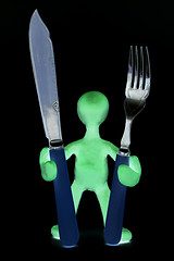 Image showing Shaded puppet  standing with tableware