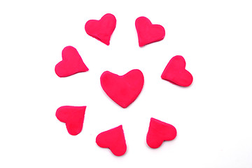 Image showing Painted pink hearts of plasticine on background