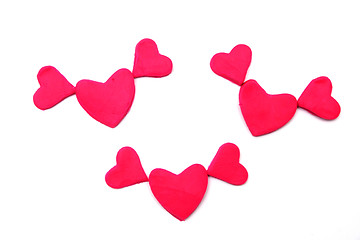 Image showing Painted pink hearts of plasticine on background