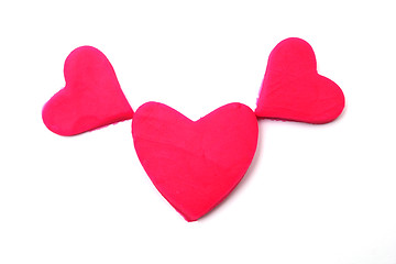 Image showing Painted pink hearts of plasticine on background