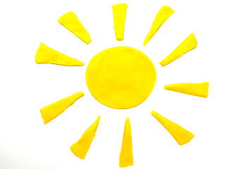 Image showing Painted yellow sun of plasticine on background