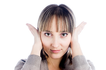 Image showing Woman covering her ears