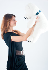 Image showing Smiling woman with bear toy