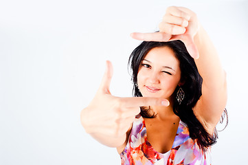 Image showing Girl with frame gesture. Focus on fingers