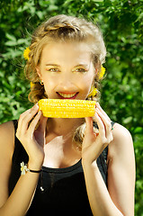 Image showing woman eating corn-cob